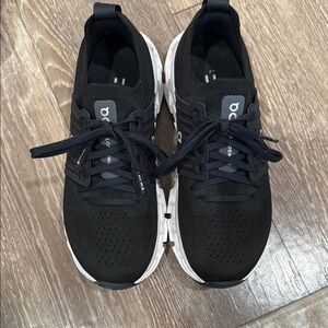 On Running Black and White Athletic Shoes with Breathable Design